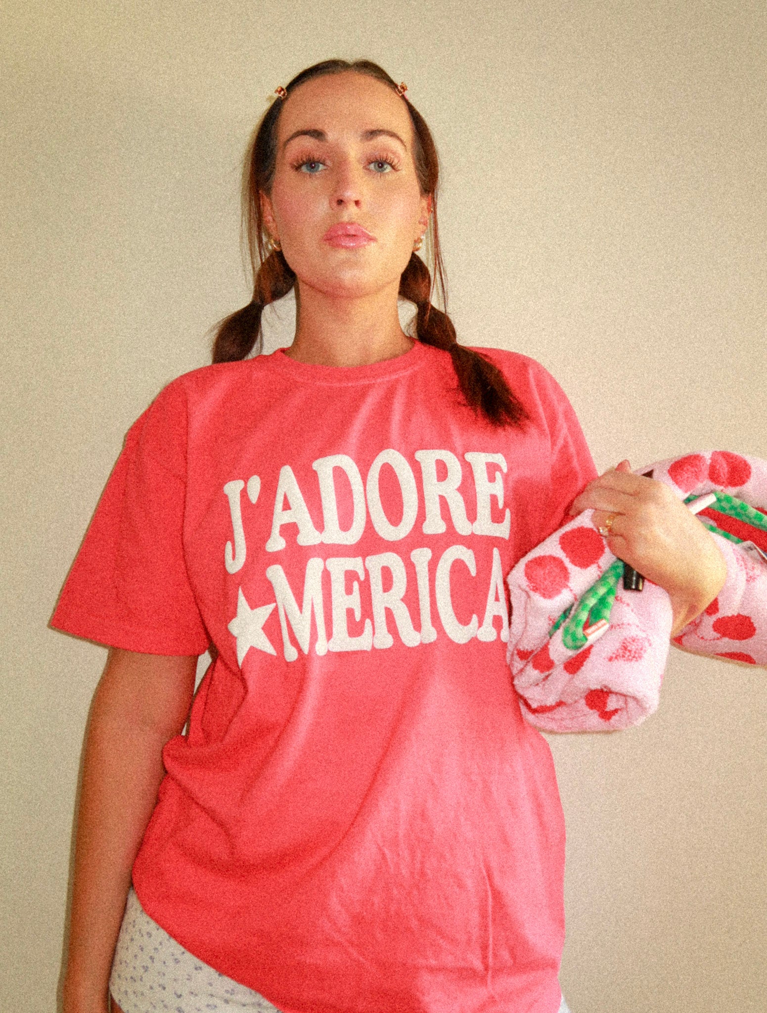 Model from waist up with soft lighting and shirt centered in frame